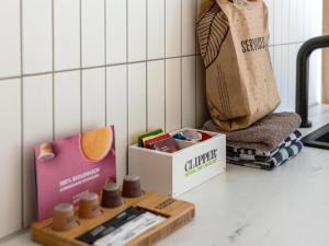 a kitchen counter with a box of spices and a bag at Mos in Nunspeet