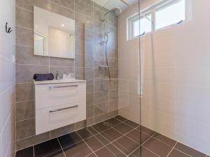 a bathroom with a shower and a sink at Kuifmees in Hulshorst +40 photos