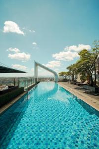 a swimming pool on top of a building at PULANG ke UTTARA in Yogyakarta