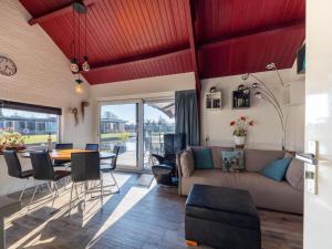 a living room with a couch and a table at Kieft in Boornzwaag