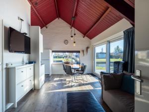 a living room with a couch and a table at Kieft in Boornzwaag