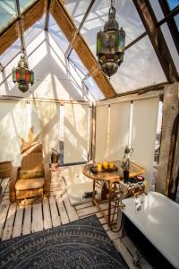 a bathroom with a tub and a sink and a bath tub at Espacio El Sol in La Tirana