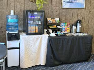 a table with a drink cooler on top of it at Town House Motor Inn in Worland