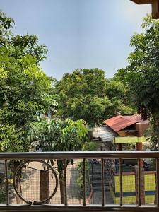 a bird sitting on top of a fence at Verde Royale Resort in Calasiao