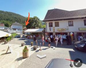 a group of people standing outside of a building at Apartman Heli Meli 2 in Jajce