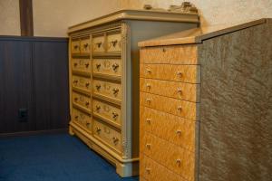 a large wooden dresser in a room at Taisho Roman-style Private Villa with Original Japanese Art 日本画原画の一棟貸し M's Lumos in Marugame