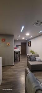 a living room with a couch and a table at Departamento Ejecutivo Rigo Tovar in Matamoros