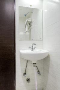 Koupelna v ubytování Hotel Raya Inn