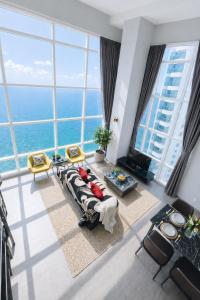 an aerial view of a living room with large windows at Panoramic Sea view 2BR Duplex High Floor George Town 203A Maritime Suite in George Town