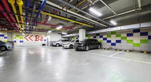 a parking garage with several cars parked in it at 바고관광호텔 in Seoul