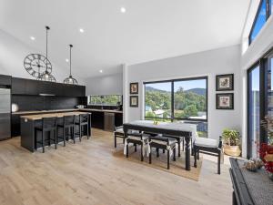 a kitchen and dining room with a table and chairs at The Nest on Hull in Marysville