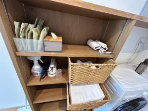 a shelf in a kitchen with a washing machine at 塔の宿 宍道湖 in Matsue +16 photos