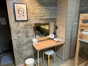 a dressing room with a table and a mirror at Osoha guest house in Samcheok