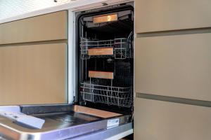 an empty dishwasher in an rv at COCO VILLA ニセコアンヌプリ-Niseko Annupuri in Rankoshi +158 photos