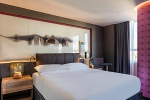 a bedroom with a large bed and a large window at Andaz Condesa Mexico City, By Hyatt in Mexico City +153 photos