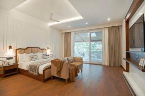 a bedroom with a bed and a large window at The Row House Kasauli in Kasauli