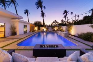 a swimming pool in the backyard of a house at Private Pool Escape Casita Mini Golf 4BR in Indio