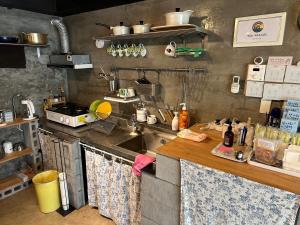 a kitchen with a sink and a counter with towels at Osoha guest house in Samcheok +21 photos