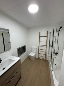 a bathroom with a sink and a toilet at El refugio de NaRo in Chella +28 photos