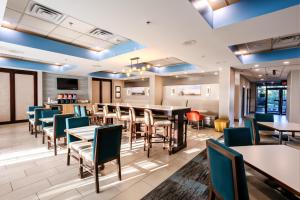 a dining room with tables and chairs at Hampton Inn Manassas in Manassas