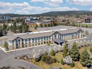 an aerial view of a building with a parking lot at Hampton Inn & Suites Bend in Bend