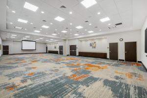 a large room with a large rug on the floor at Hampton Inn & Suites Bend in Bend +47 photos