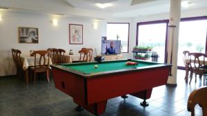 a living room with a pool table and a tv at Casa Di Angel in Sinemorets