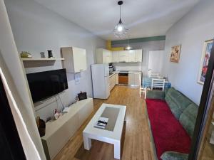 a living room with a couch and a table at central apart in Tirana