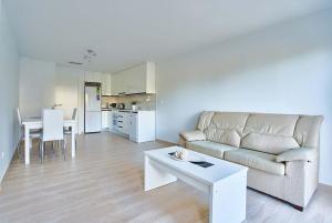 a living room with a couch and a table at Espanhouse Pinada Beach in La Marquesa