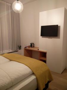 Postel nebo postele na pokoji v ubytování b&b les invités