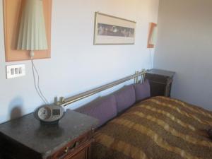 A bed or beds in a room at Casa Vacanze Mazzanti