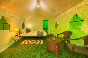 a room with a bed in a tent at The Himalayan Swiss Cottage with Bonfire, Manali - A Riverside Retreat in Manāli +36 photos