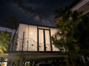 a balcony of a house with a starry sky at Appartement Ivandry "Résidence Pascal" in Antananarivo