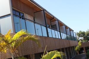 an external view of a building with glass windows at Big Blue Sodwana Bay in Sodwana Bay
