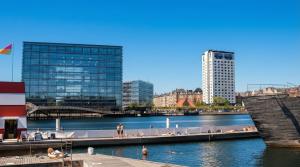 a group of people in the water in a city at Danhostel Copenhagen City & Apartments in Copenhagen