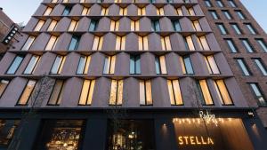 a tall building with many windows at Ruby Stella Hotel London by IHG in London