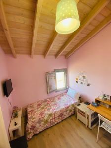 a bedroom with a bed and a desk at Athos view house in Agios Ioannis Kaspaka +9 photos
