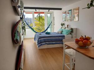 a bedroom with a bed and a table with a bowl of fruit at La Pineda Pisito Playero in La Pineda