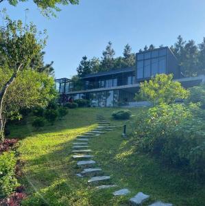 a stone path leading up to a house at Pine Hill Villa 3 Vì in Ba Vì