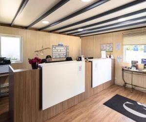a large room with a counter and a kitchen at Cottage PARKS ESCAPADE COLOMBA in Olmeto +30 photos