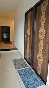 a room with a door with a rug on the floor at Hill valley farm resort in Munnar +31 photos
