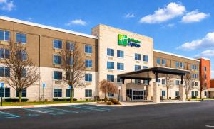 an exterior view of a hotel with a building at Holiday Inn Express Wixom by IHG in Wixom