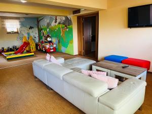 a living room with a couch and a table at Hotel Bystrina in Belá