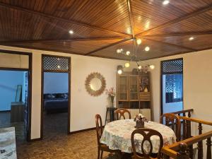 a dining room with a table and some chairs at Aadaraya Colombo 7 in Colombo