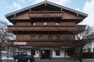 a building with a truck parked in front of it at Superseegarten in Bad Wiessee +14 photos