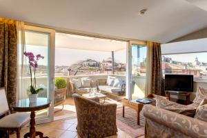 a living room with a view of the city at Hotel Nazionale in Rome