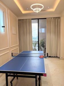 a ping pong table in the middle of a room at Ek Tara Guest House in Udaipur
