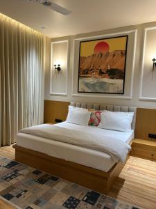 a bedroom with a large bed with white sheets at Ek Tara Guest House in Udaipur