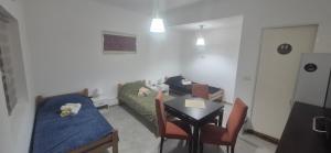 a living room with a couch and a table with chairs at Odmorište Noćko in Valjevo