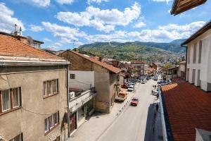 a view of a city street with buildings and cars at Urban Getaway Sarajevo with Free Parking in Sarajevo